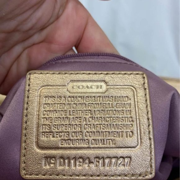 COACH gold handbag. Purple lining. Embedded coach logo. Big outside pock… - Picture 9 of 10